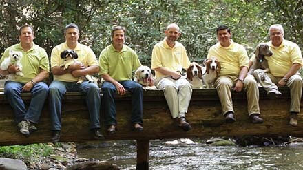 The leadership team at Big Creed Foods with their dogs