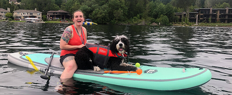 Woman and Dog on Paddleboard